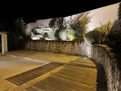 a stone wall with a bunch of plants on it at Villa climatisée avec piscine à St Remy in Saint-Rémy-de-Provence