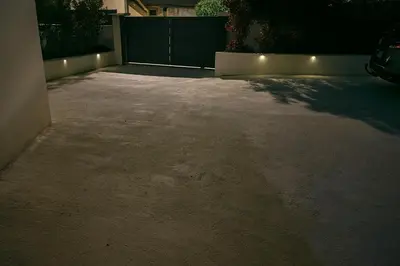 a parking lot at night with a driveway at Maison, Jardin, piscine parking près d'Aix Centre in Venelles