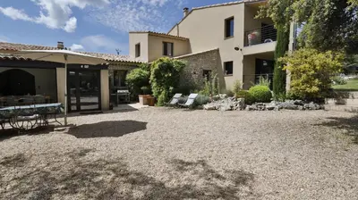 a house with a gravel yard in front of it at Coin de paradis en Provence in Sault-de-Vaucluse