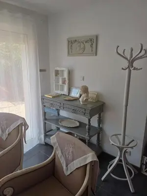 a room with a table and a chair and a desk at Gite Au fond du jardin in Saint-Saturnin-lès-Avignon