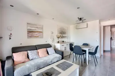 a living room with a couch and a table at Village Pont Royal en Provence - maeva Home - Appartement cosy et climatisé 2 pièces 4 personnes - Prestige - super Home MAE-2164 in Mallemort
