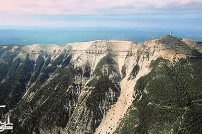 an aerial view of a mountain with a lighthouse on it at Villa tout confort, piscine - Au pied du VENTOUX in Saint-Didier