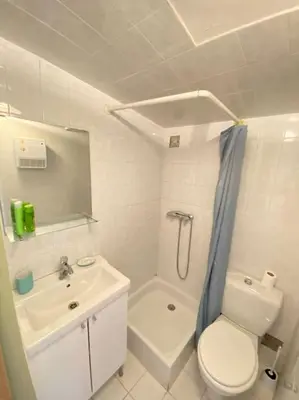 a bathroom with a toilet and a sink and a shower at Maisonnette à la campagne. Idéal Télétravail in Éguilles