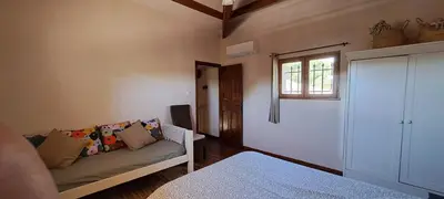 a living room with a couch and a window at La Ribasse en Provence in Venelles