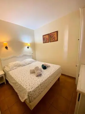 a bedroom with a bed with towels on it at Village Pont Royal en Provence - maeva Home - Appartement climatisé 2 pièces 6 personnes - Confort MAE-1684 in Mallemort