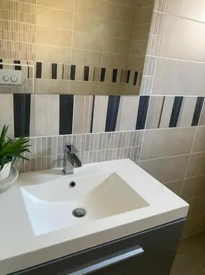 a bathroom with a white sink in a room at Olympe de Provence in Caromb