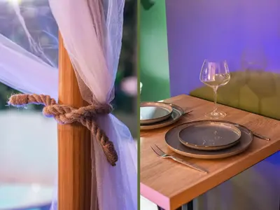a table with a plate and a glass of wine at Sault Tropical - Idéal couple - Balnéo Led - Vue parc & montagne - Wifi - Stationnement gratuit - 5min à pied des bars, restaurants & commerces in Sault-de-Vaucluse