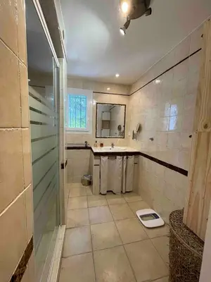 a bathroom with a shower and a sink and a toilet at Villa avec Piscine au coeur de la campagne provençale in Lançon-Provence