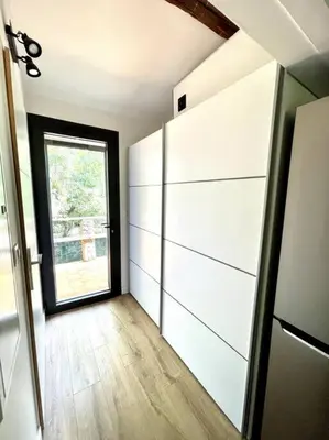 a room with a room with a window and a large closet at Ravissant appartement à 5min du centre ville d'Aix in Aix-en-Provence