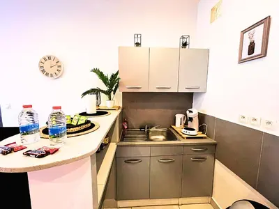 a small kitchen with a sink and a counter at Carré Rouge*Gare Sncf*Fibre Wifi in Miramas
