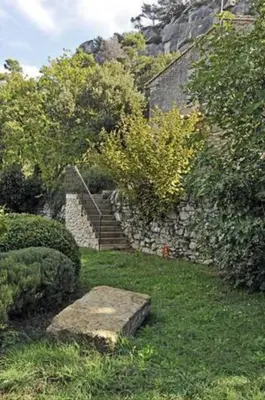 a stone stairway leading to a house with a stoneestone sidx sidx sidx at Superbe Mas Authentique du Luberon Courroussouvo in Oppède