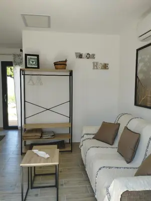 a living room with two couches and a table at Studio de charme en Provence in Caromb