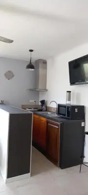 a kitchen with a sink and a stove top oven at Campagne Carbonel in Aix-en-Provence