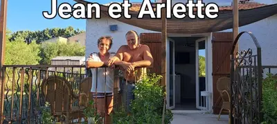 a man and woman standing in front of a gate at Campagne Carbonel in Aix-en-Provence