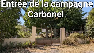 an entrance gate to a garden with the words enterance carandon at Campagne Carbonel in Aix-en-Provence