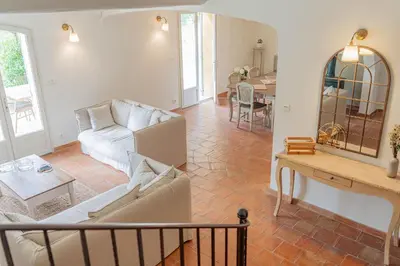 a living room with a couch and a table at Maison à 2 pas du Village D'ansouis à 30 Minutes D'aix-en-provence in Ansouis
