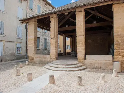 a large building with a large wooden structure at Holiday Home in Vaucluse near Mont Ventoux in Pernes-les-Fontaines