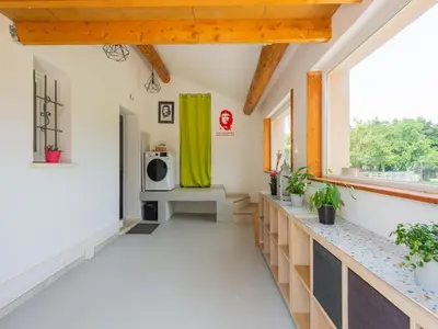a hallway of a house with a yellow curtain at Holiday Home in Vaucluse near Mont Ventoux in Pernes-les-Fontaines