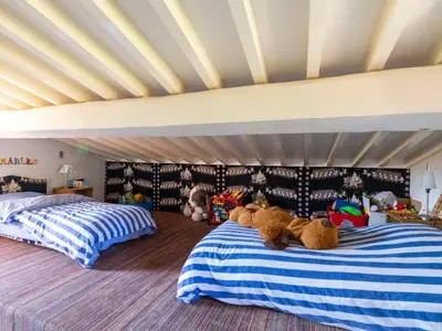 a bedroom with two beds with teddy bears on them at Holiday Home La Tourelle des Ocres by Interhome in Roussillon