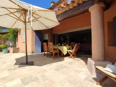 a patio with an umbrella and a table and chairs at Holiday Home La Tourelle des Ocres by Interhome in Roussillon
