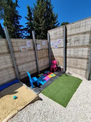 a backyard with a sandbox and a play area at Villa lavandin in Apt