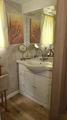 a bathroom with a sink and a mirror at TOSCANE in Saint-Rémy-de-Provence