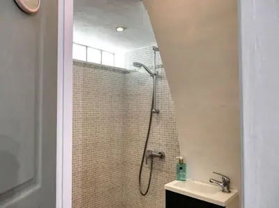 a bathroom with a shower and a sink at Village house of Jean in Gordes