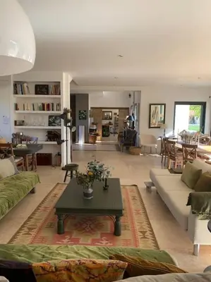 a living room with a couch and a table at Contemporary house 5mn away from Aix in the countryside in Aix-en-Provence