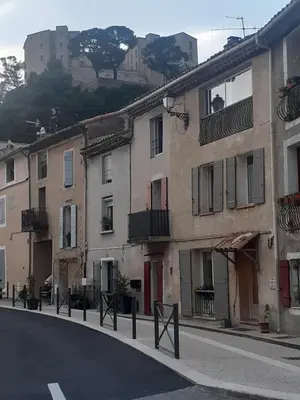 a row of buildings on the side of a street at Aude en Provence in Meyrargues