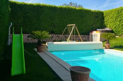 a table with fruit and drinks and a pineapple on it at Charming Villa with pool, close to city center in Aix-en-Provence