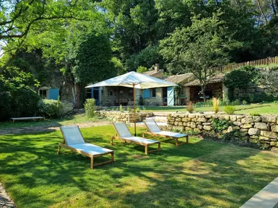 a group of chairs in a yard with a tent at Magnifique Mas Provençal in Lauris