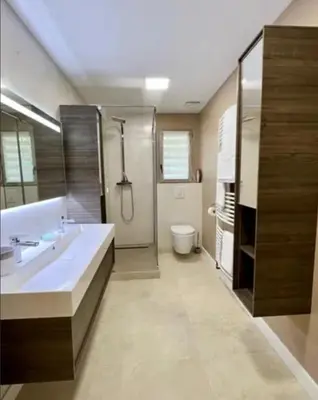 a bathroom with a sink and a shower and a toilet at Maison à Gordes dans le Lubéron in Gordes