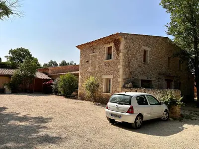 a white car parked in front of a building at Maison à Gordes dans le Lubéron in Gordes