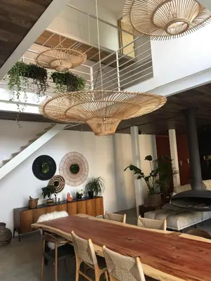 a dining room with a wooden table and chairs at Un loft en Provence in Carpentras