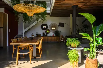 a dining room with a table and some plants at Un loft en Provence in Carpentras