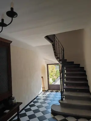 a stairway in a house with a spiral staircase at Coeur de Provences in Saint-Didier