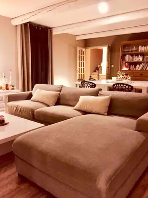 a living room with two couches and a table at villa entre st rémy de provence et avignon in Noves