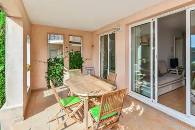 a patio with a table and chairs on a balcony at Village Pont Royal en Provence - maeva Home - Appartement 2 pièces 5 personnes Sélection MAE-2264 in Mallemort