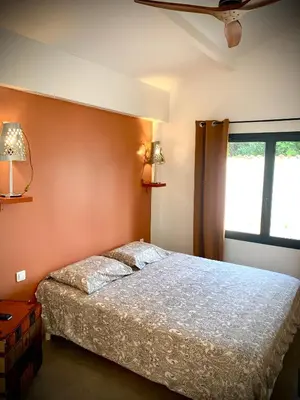 a bedroom with a bed and a window at Viva la vida in Entraigues-sur-la-Sorgue