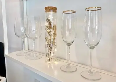 a row of wine glasses sitting on a shelf at Ma place au sud 1.08 in Éguilles