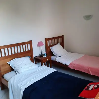 two beds sitting next to each other in a room at Maison provençale rénovée in Pernes-les-Fontaines