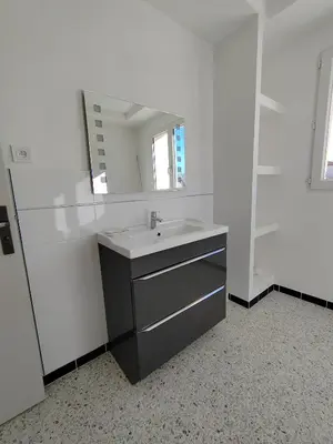 a bathroom with a sink and a mirror at Maison provençale rénovée in Pernes-les-Fontaines