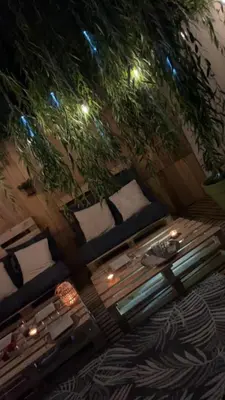 an overhead view of a table and chairs with lights at LE MAS MILA in Monteux
