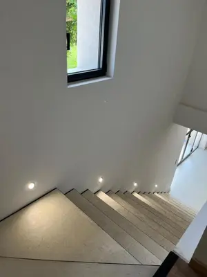 a staircase in a house with a window at LE MAS MILA in Monteux