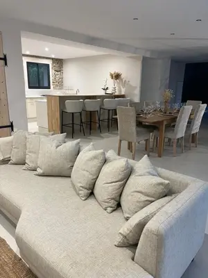 a couch with pillows sitting in a living room at LE MAS MILA in Monteux