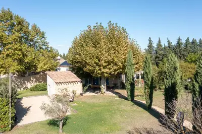 an aerial view of a yard with trees and a house at Mirabelle en Provence in Eygalières
