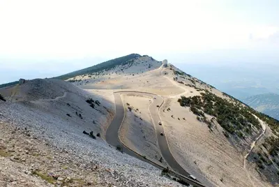 a winding road on the side of a mountain at vacances en provence olivier in Mormoiron
