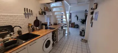 a kitchen with a sink and a washing machine at Appartement duplex sur les toits d'Aix avec terrasse ensoleillée in Aix-en-Provence