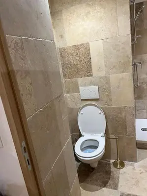 a small bathroom with a toilet and a shower at 4M Studio in Jouques
