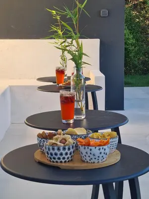 a tray of food on a table with bowls of food at Villa de luxe en Provence Piscine Chauffée in Puget